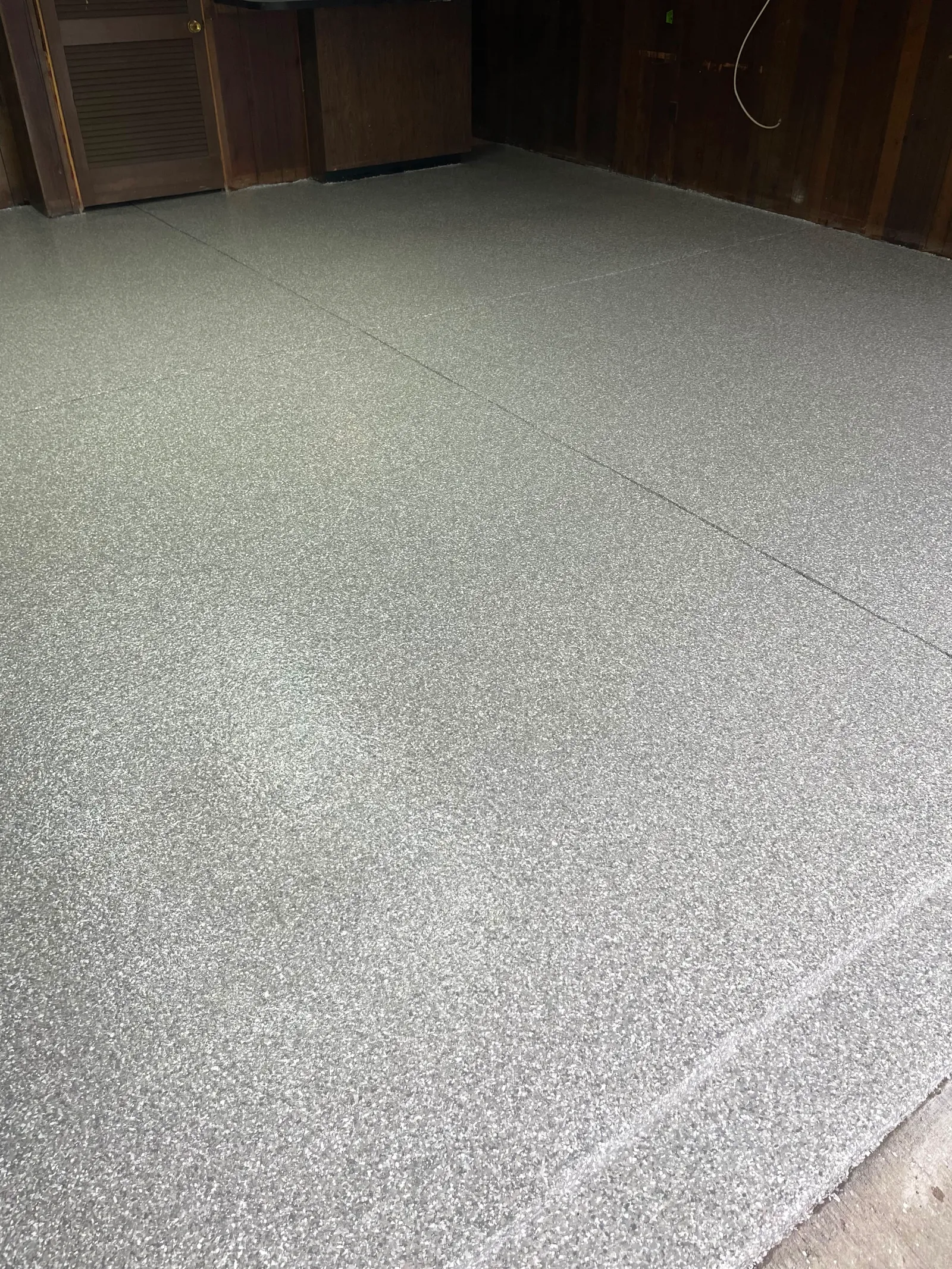 Close view of a light-toned decorative quartz aggregate floor finish