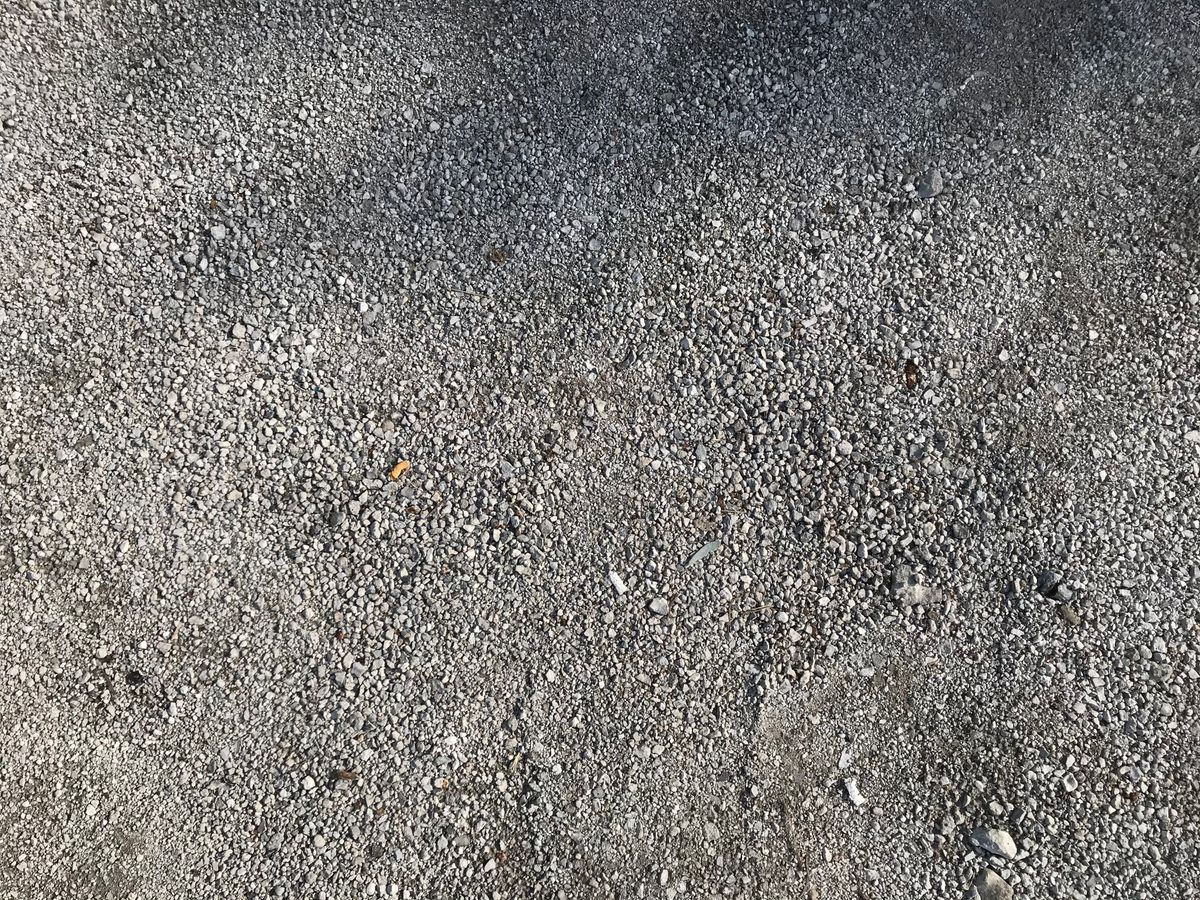 Exposed-aggregate concrete driveway surface