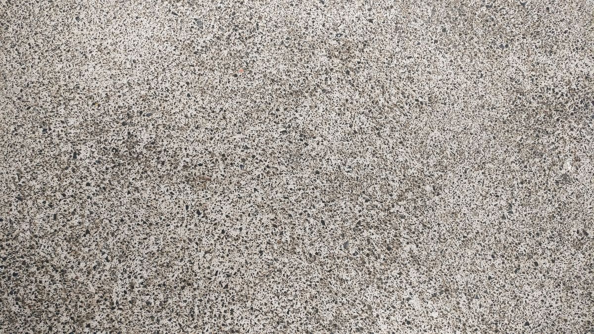 Close-up of a sealed decorative quartz / flake floor finish